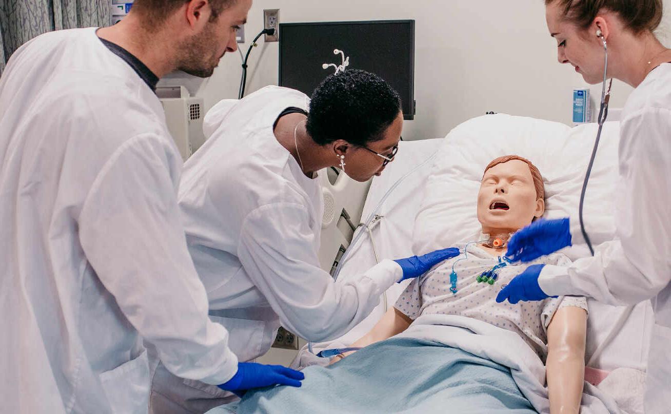 Photo of nursing students with mannequin